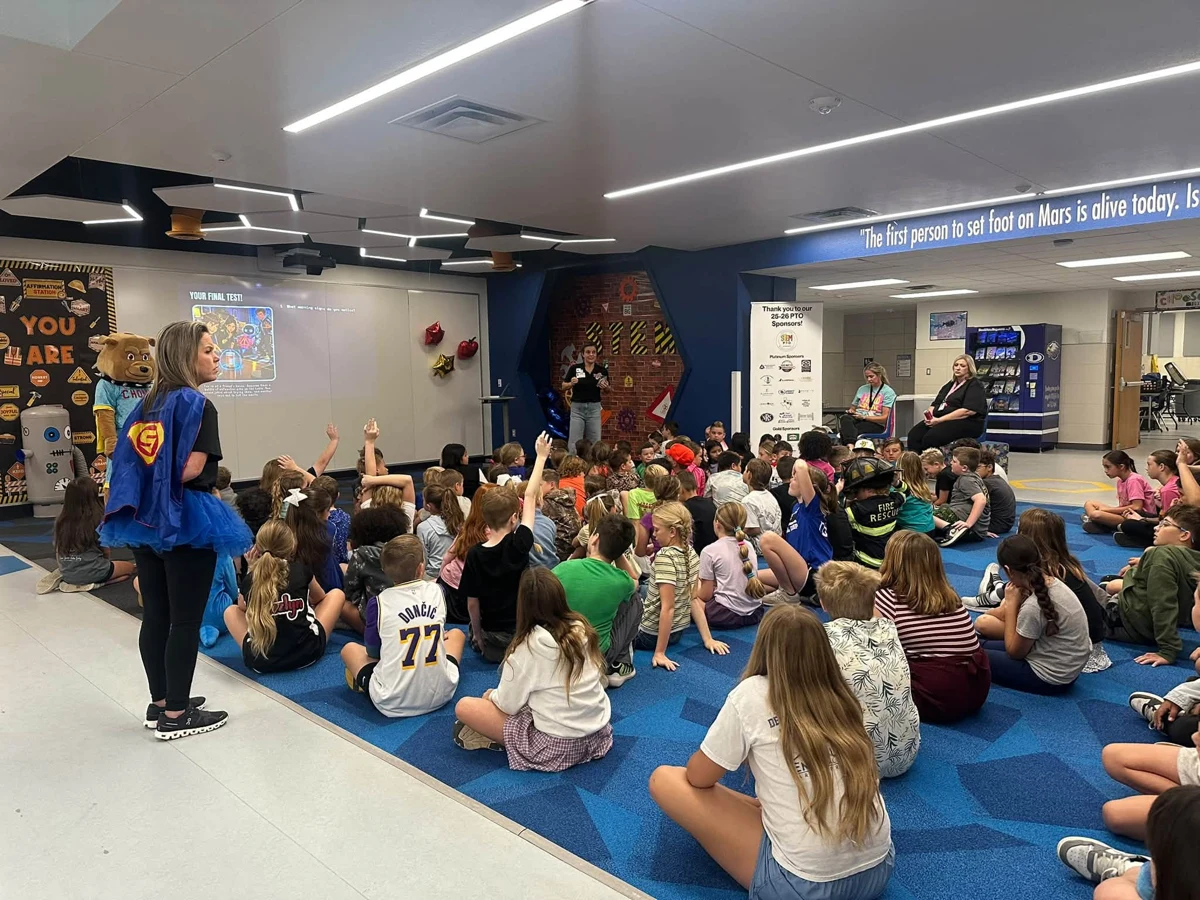 STOMP presenter speaking to students at Enis Elementary
