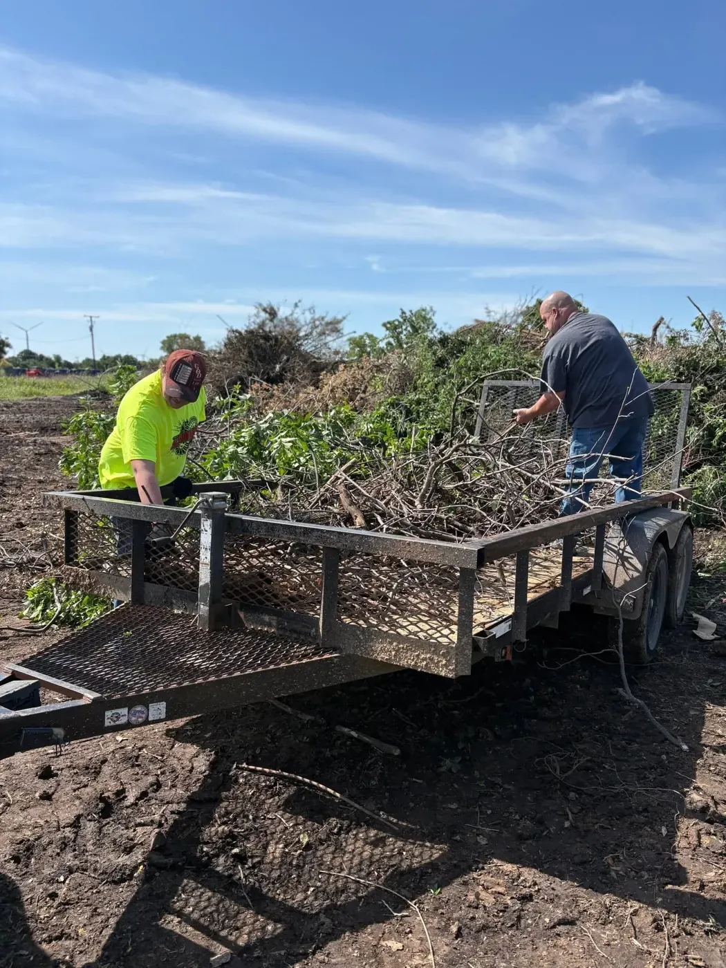 Volunteers gathering branches