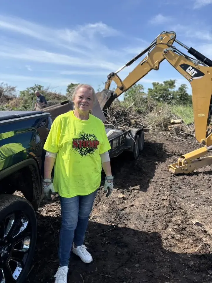 STOMP volunteer with cleanup equipment