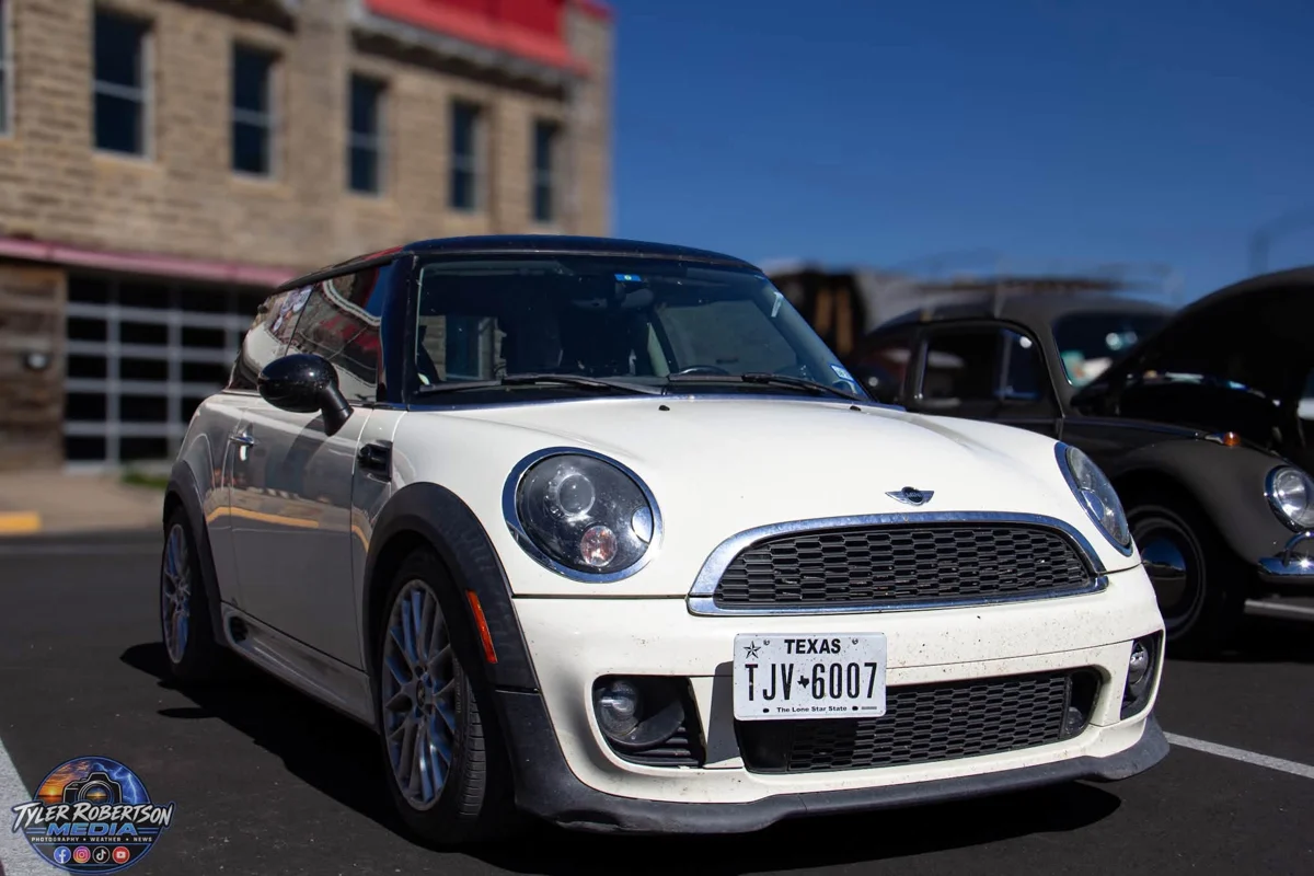 White Mini Cooper on display at STOMP Fest 2026