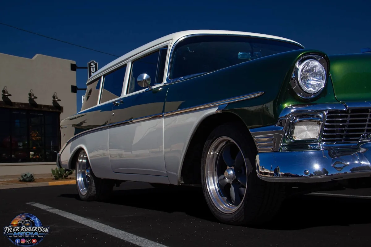 Green and white classic Chevrolet wagon on display at STOMP Fest 2026