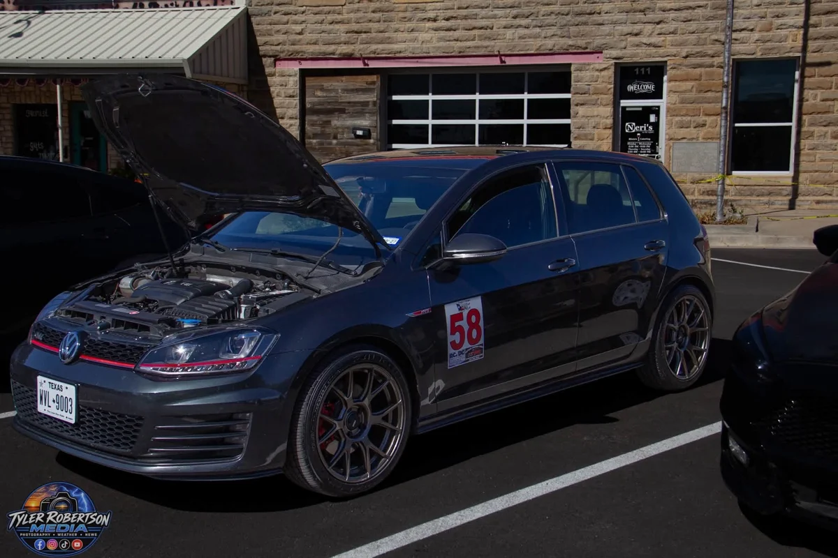 Volkswagen hatchback with its hood open at STOMP Fest 2026