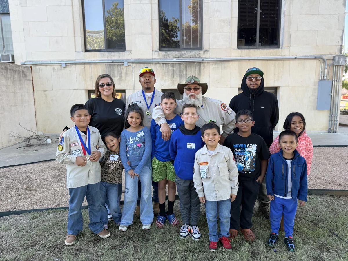 Derby participants and families posing together