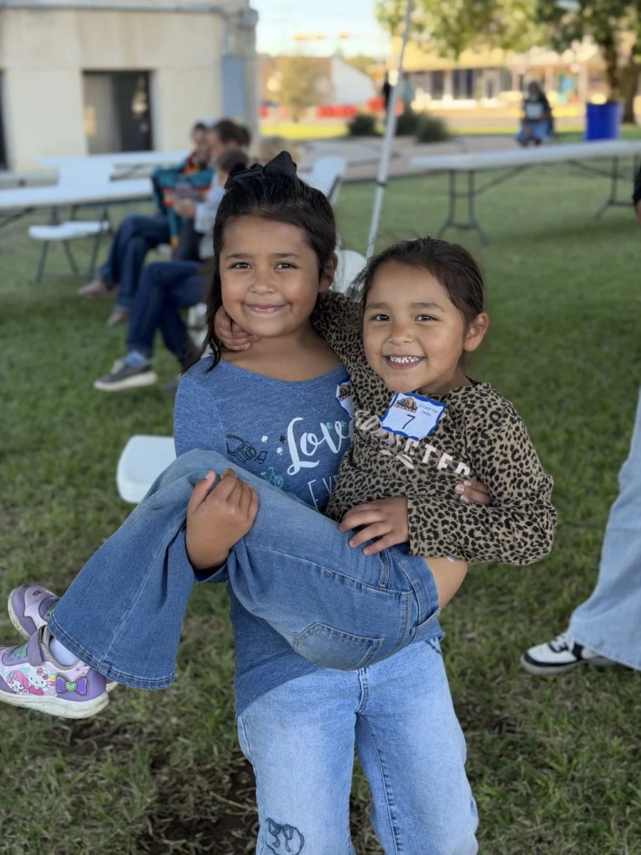Two young festival participants smiling together