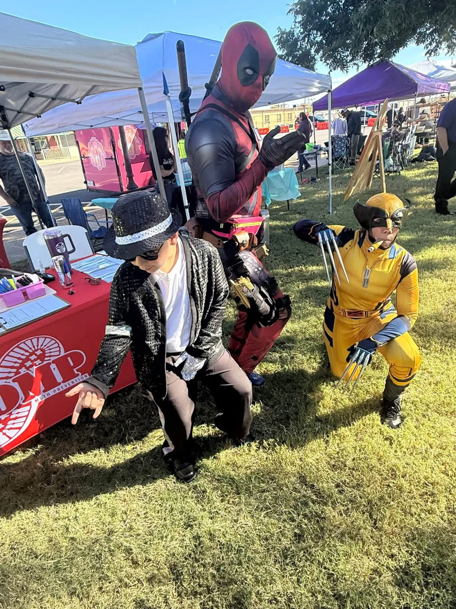 Costumed guests posing together at STOMP Fest 2026